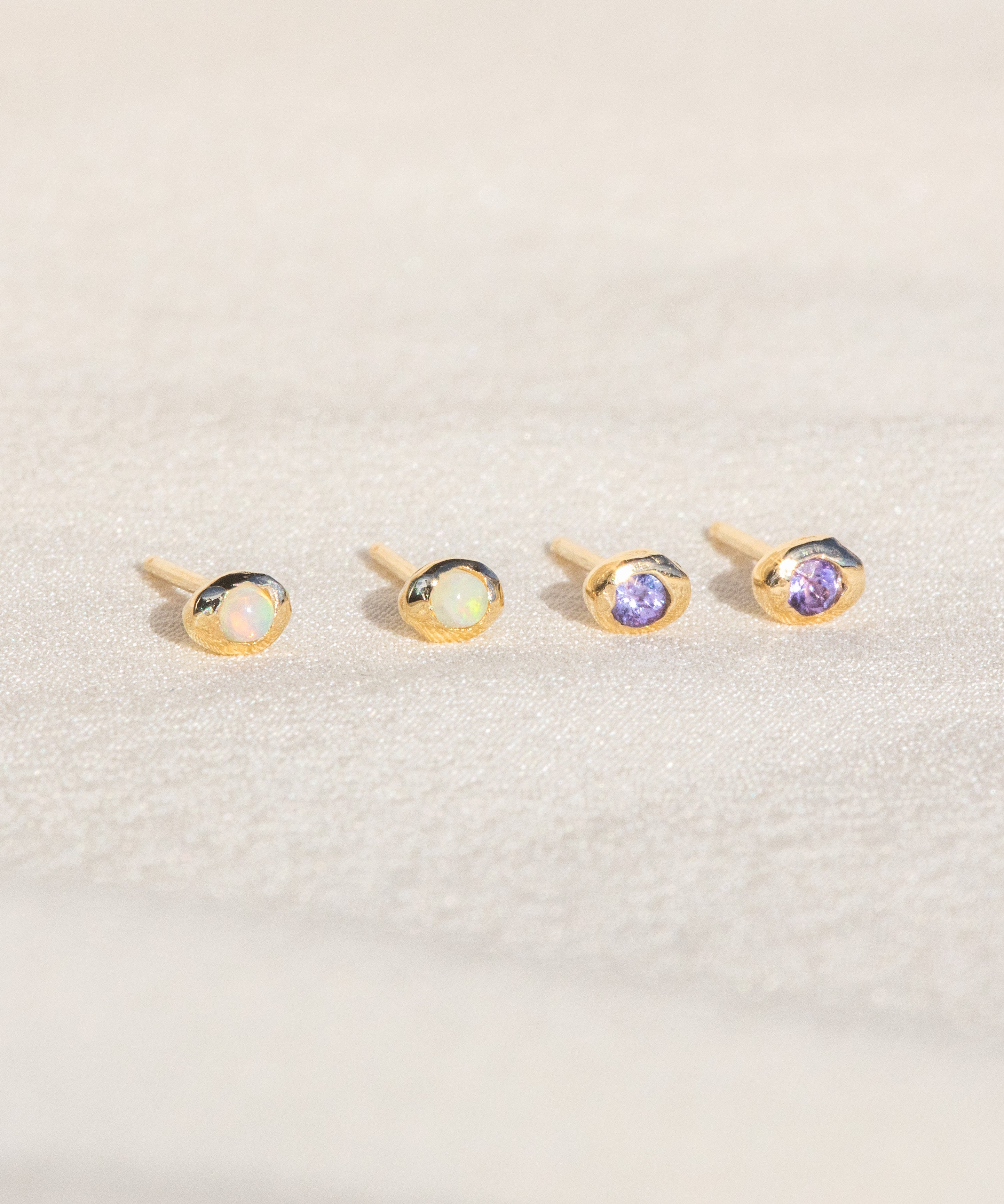 14kt Gold Studs featuring a 2mm Tanzanite and 2mm Opal