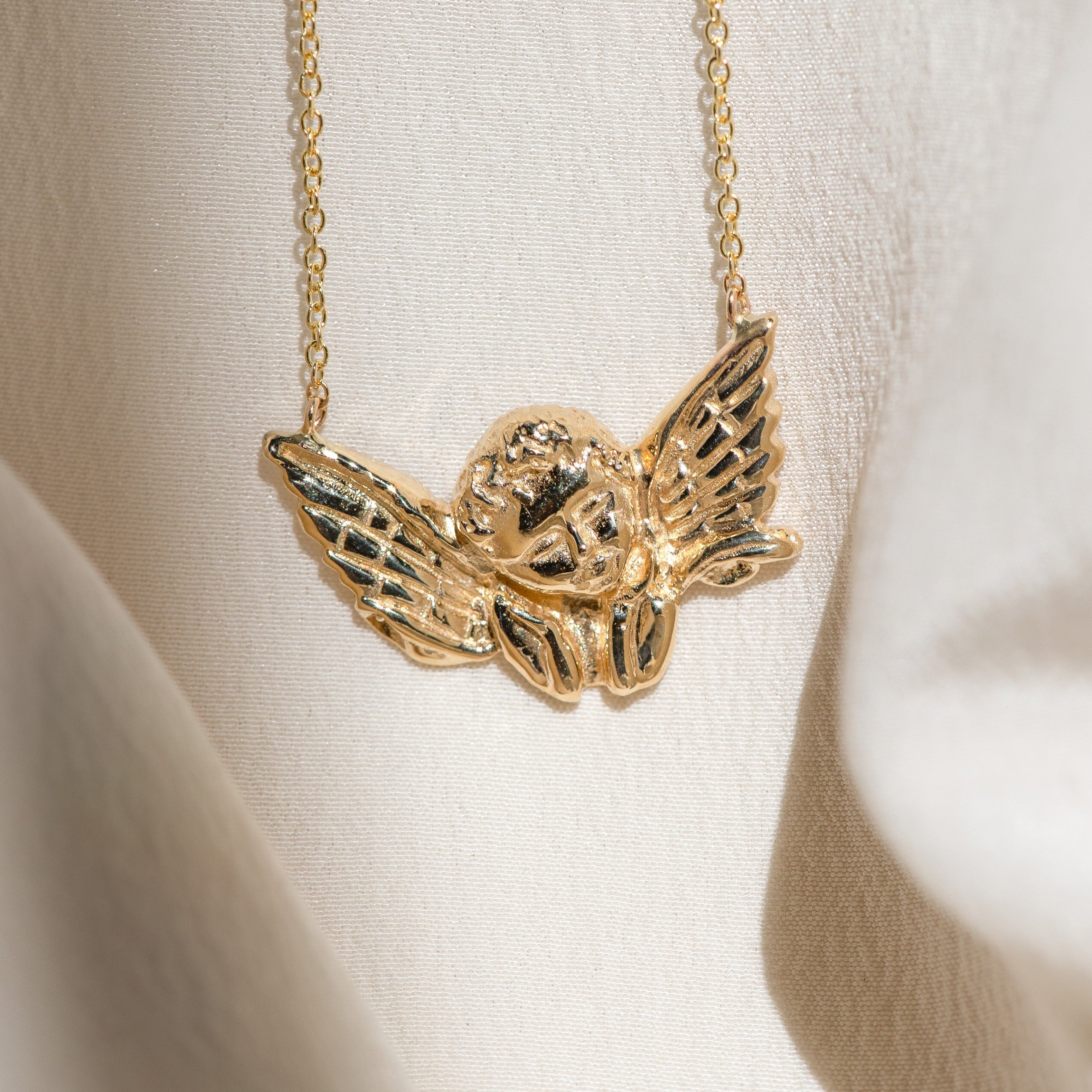 Cherub Pendant: Angelic Guidance in Golden Form