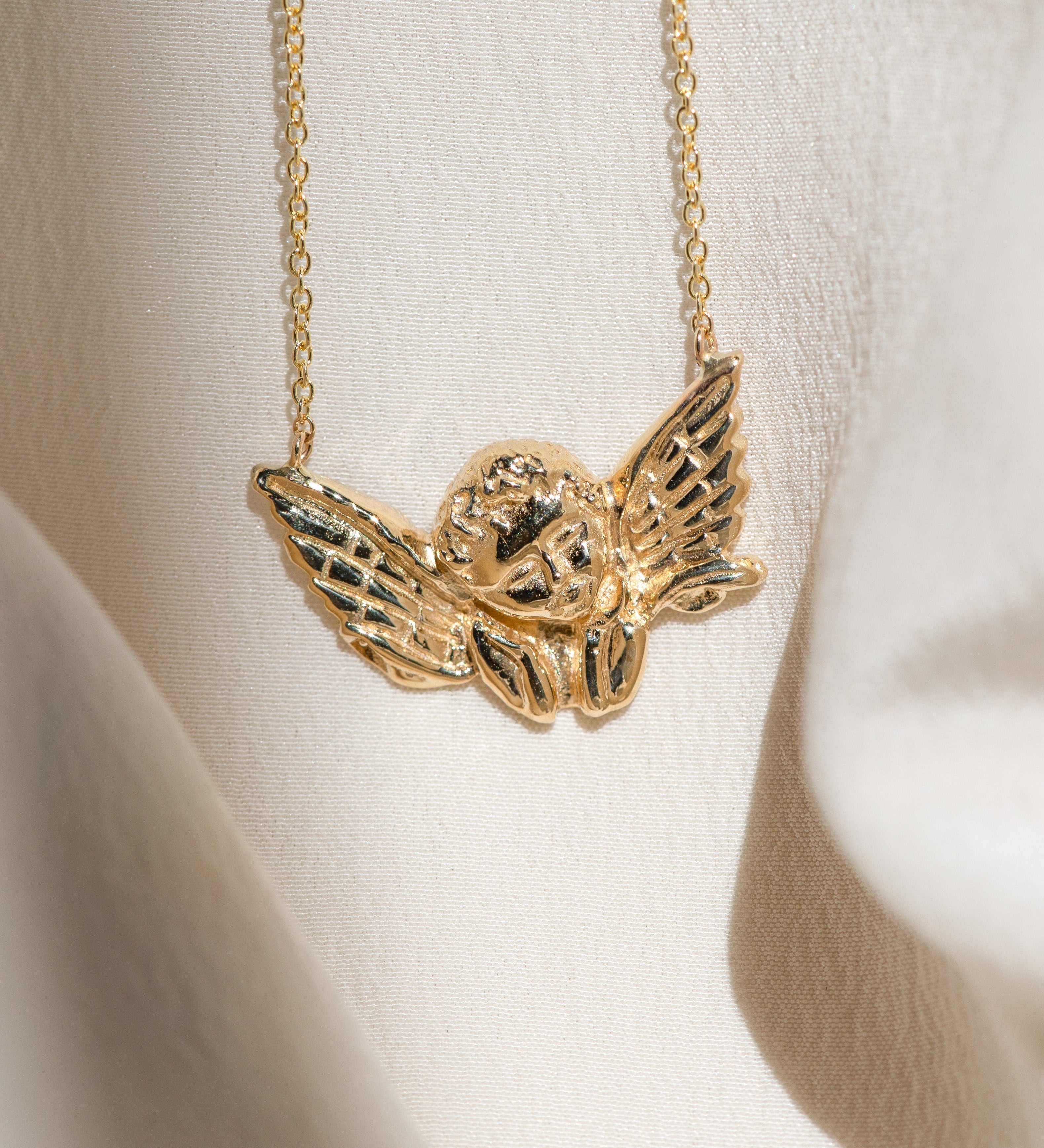 Cherub Pendant: Angelic Guidance in Golden Form