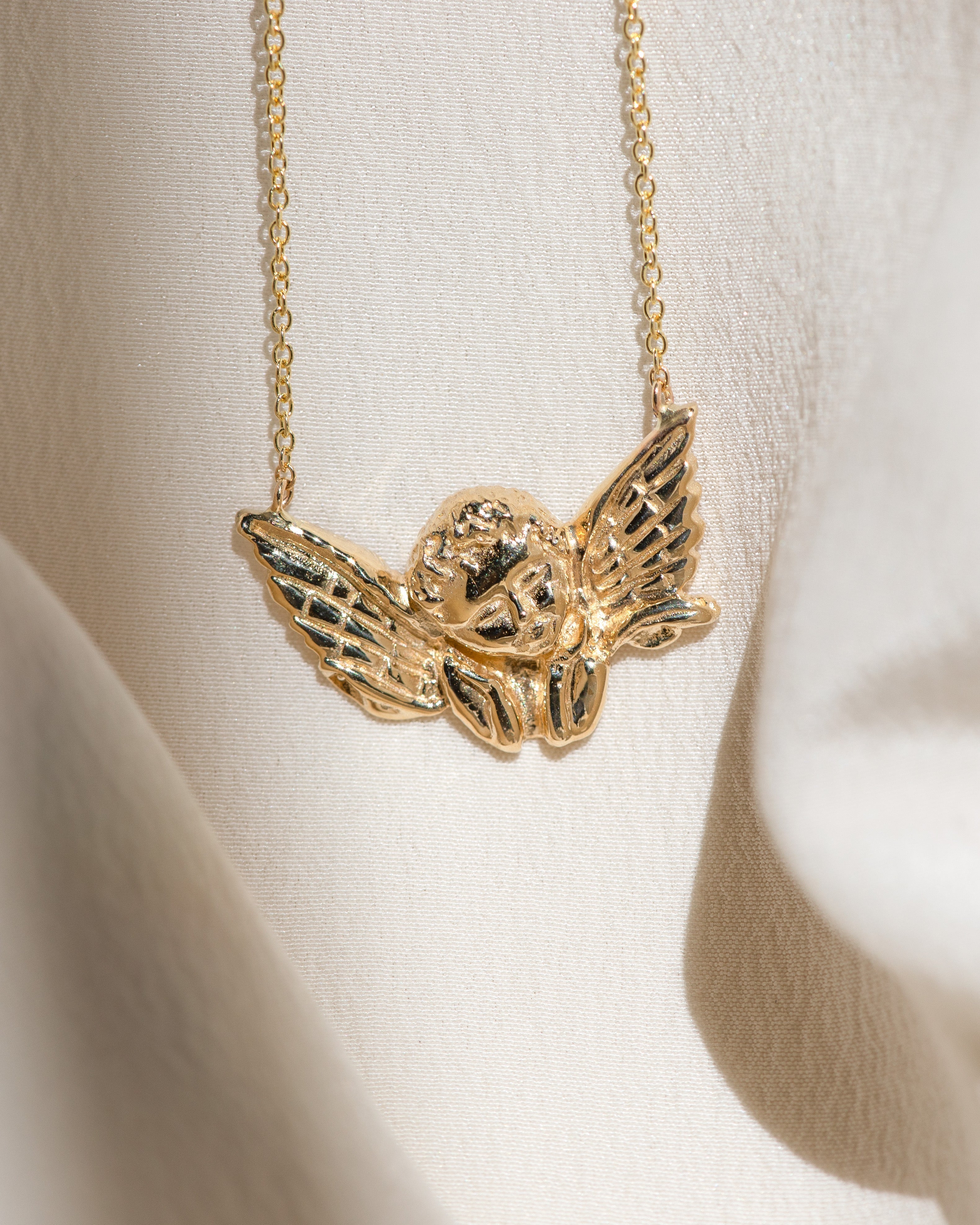 Cherub Pendant: Angelic Guidance in Golden Form