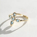 Cross ring with aquamarine stones