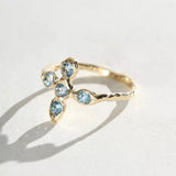 Cross ring with aquamarine stones