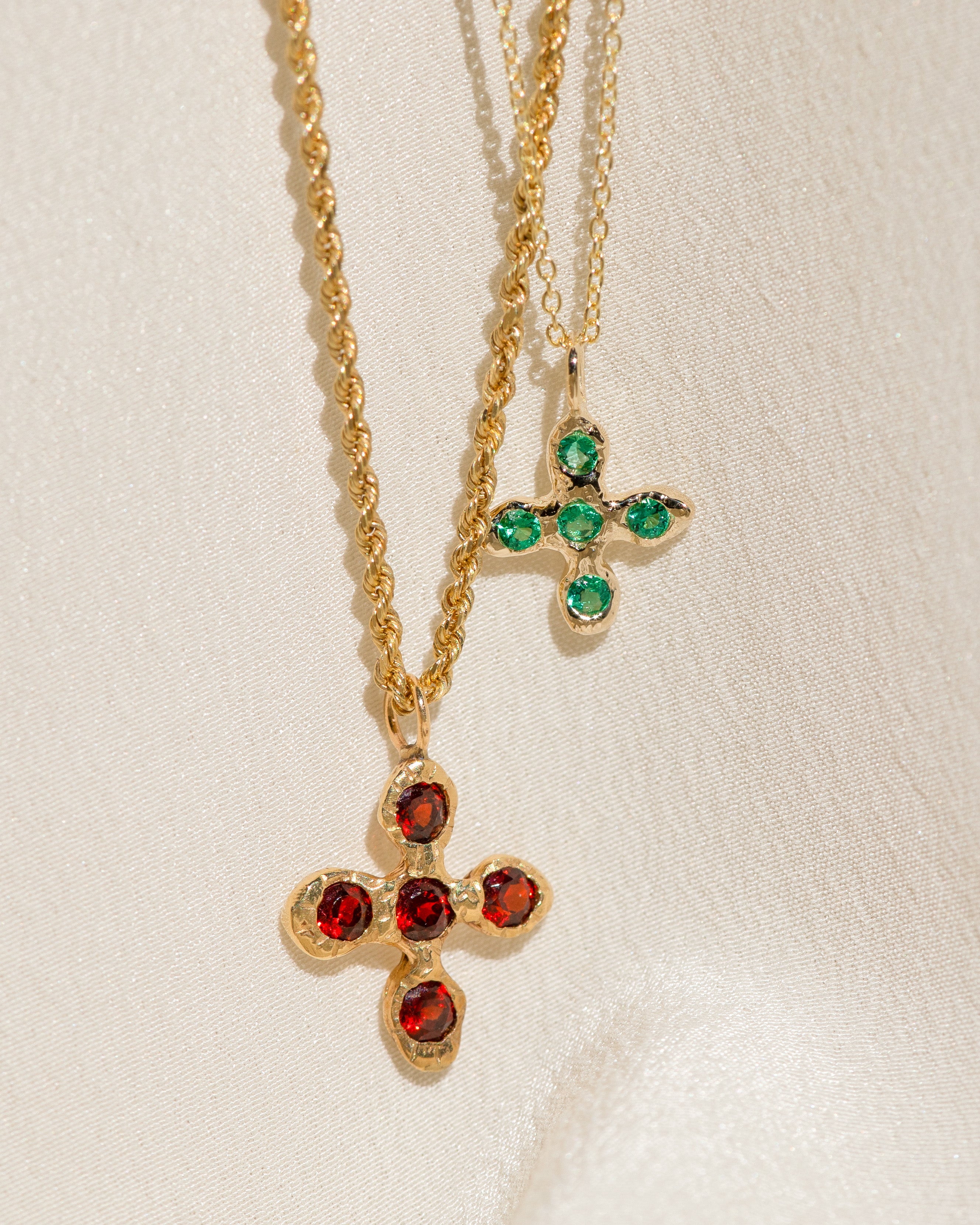 Croix du Sacralité in Garnet; Baby Croix in Emerald