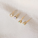 Pair of gold Heirloom Studs and Baby Heirloom Studs with opal stones