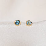Pair of gold Heirloom Stud earrings with aquamarine stones