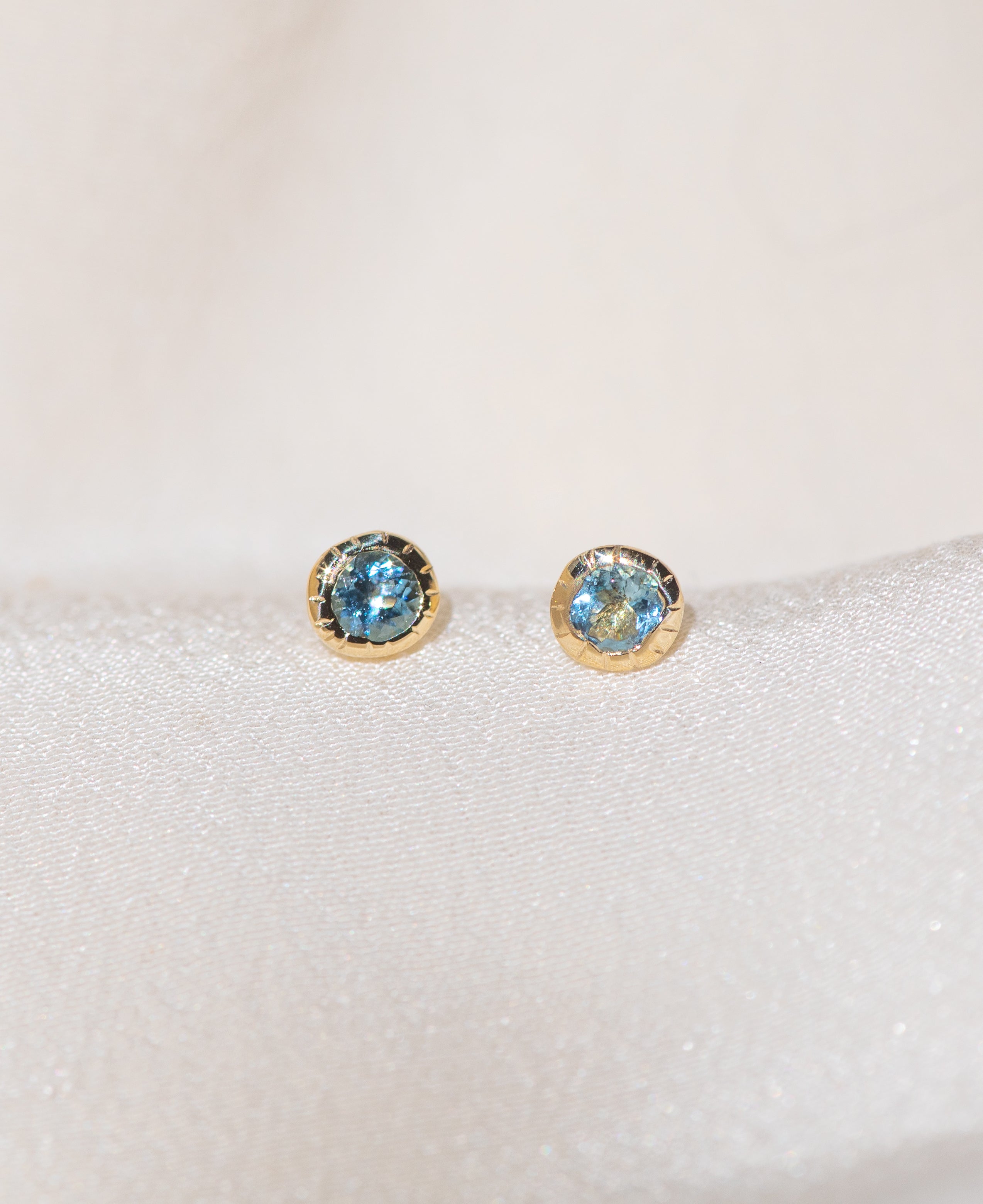 Pair of gold Heirloom Stud earrings with aquamarine stones