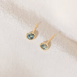 Pair of gold Heirloom Stud earrings with aquamarine stones