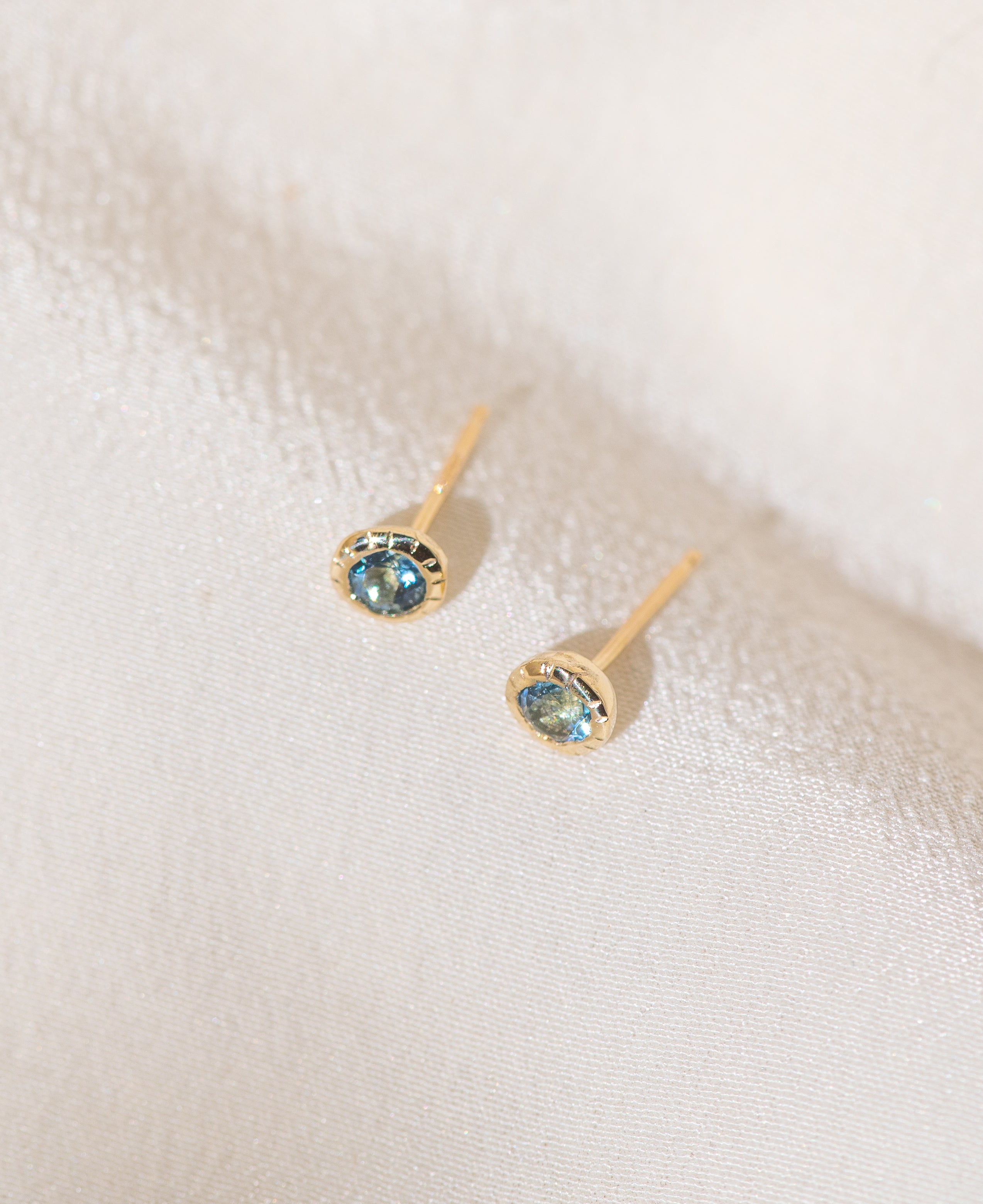 Pair of gold Heirloom Stud earrings with aquamarine stones