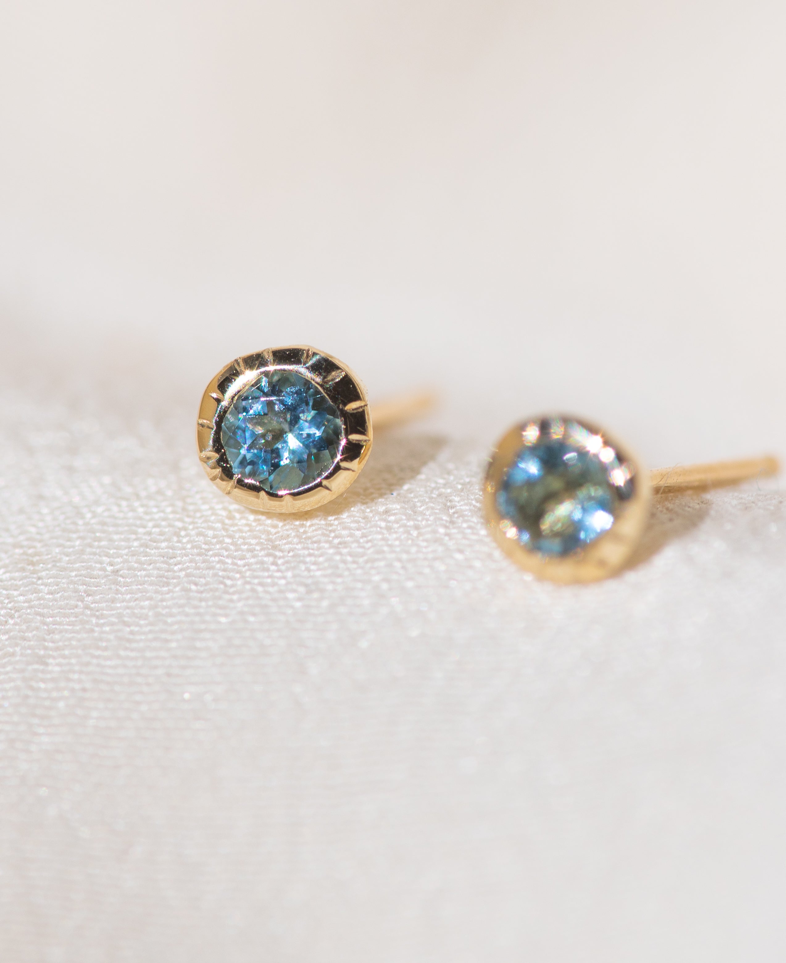 Pair of gold Heirloom Stud earrings with aquamarine stones