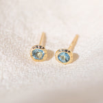 Pair of gold Heirloom Stud earrings with aquamarine stones