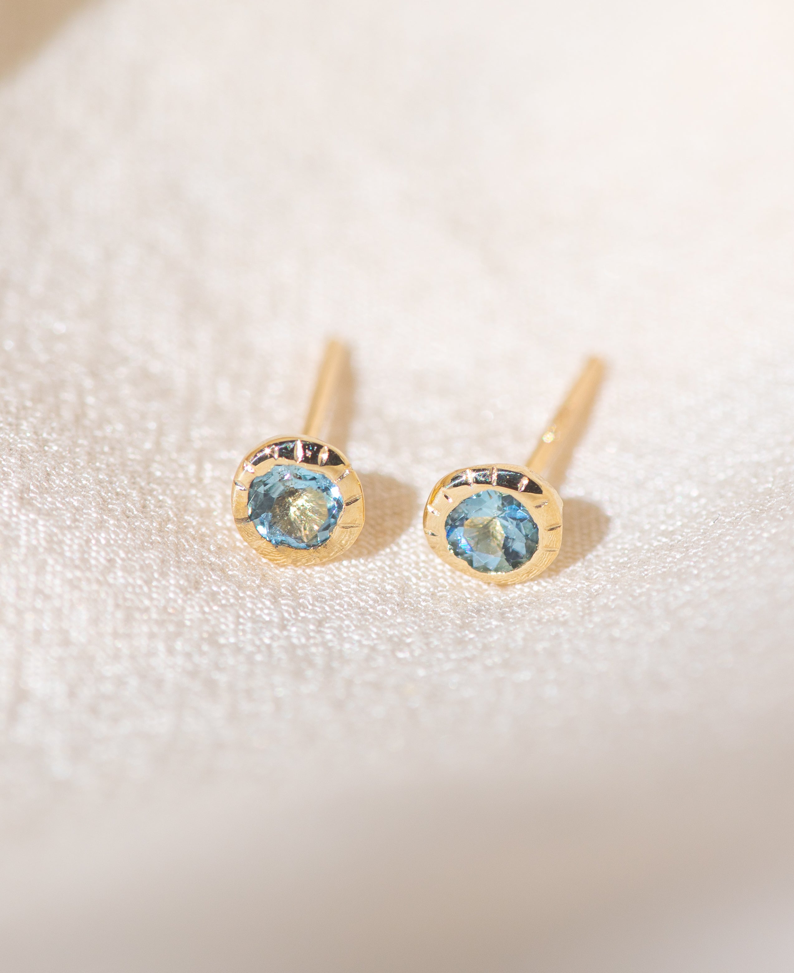 Pair of gold Heirloom Stud earrings with aquamarine stones
