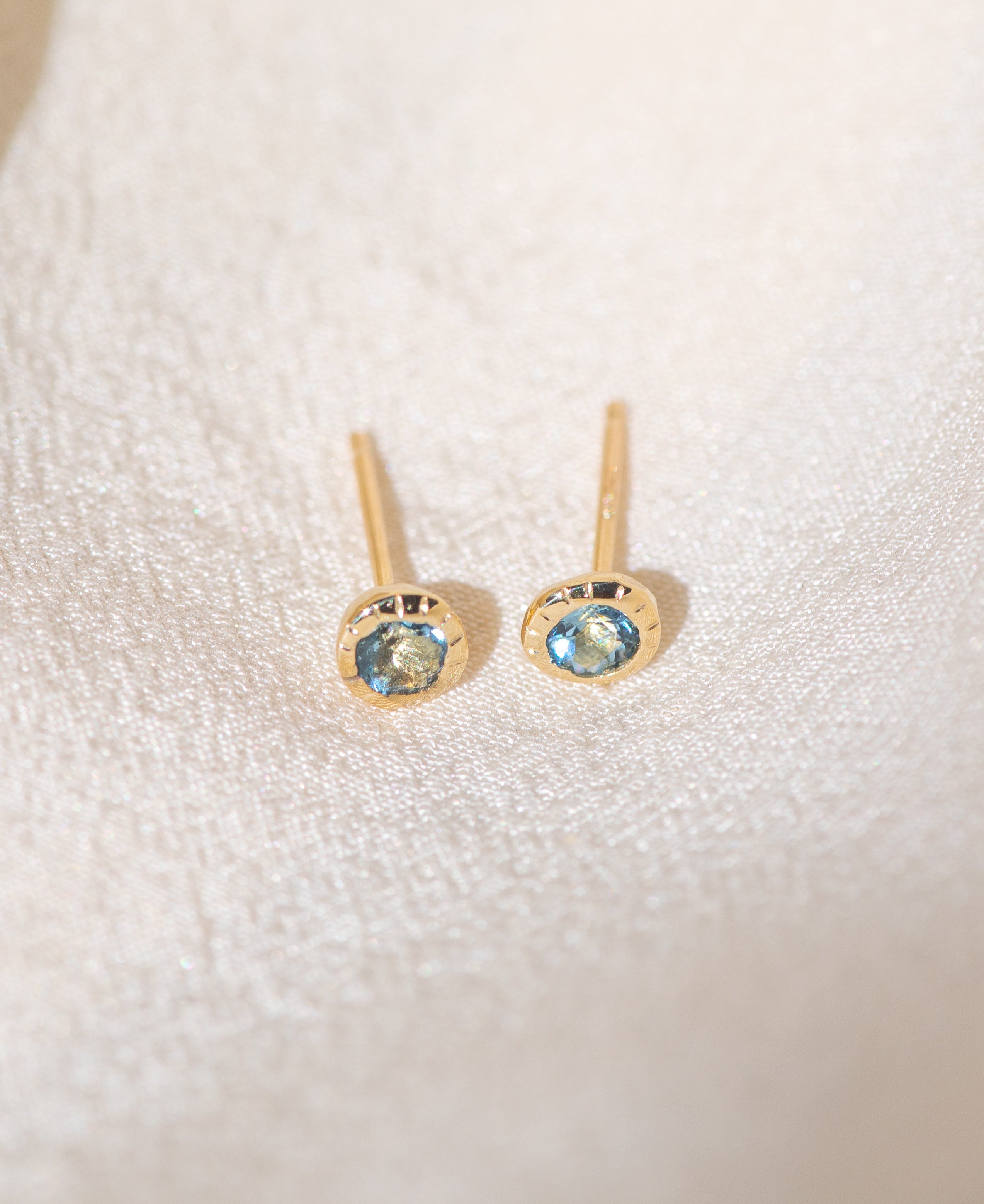 Pair of gold Heirloom Stud earrings with aquamarine stones