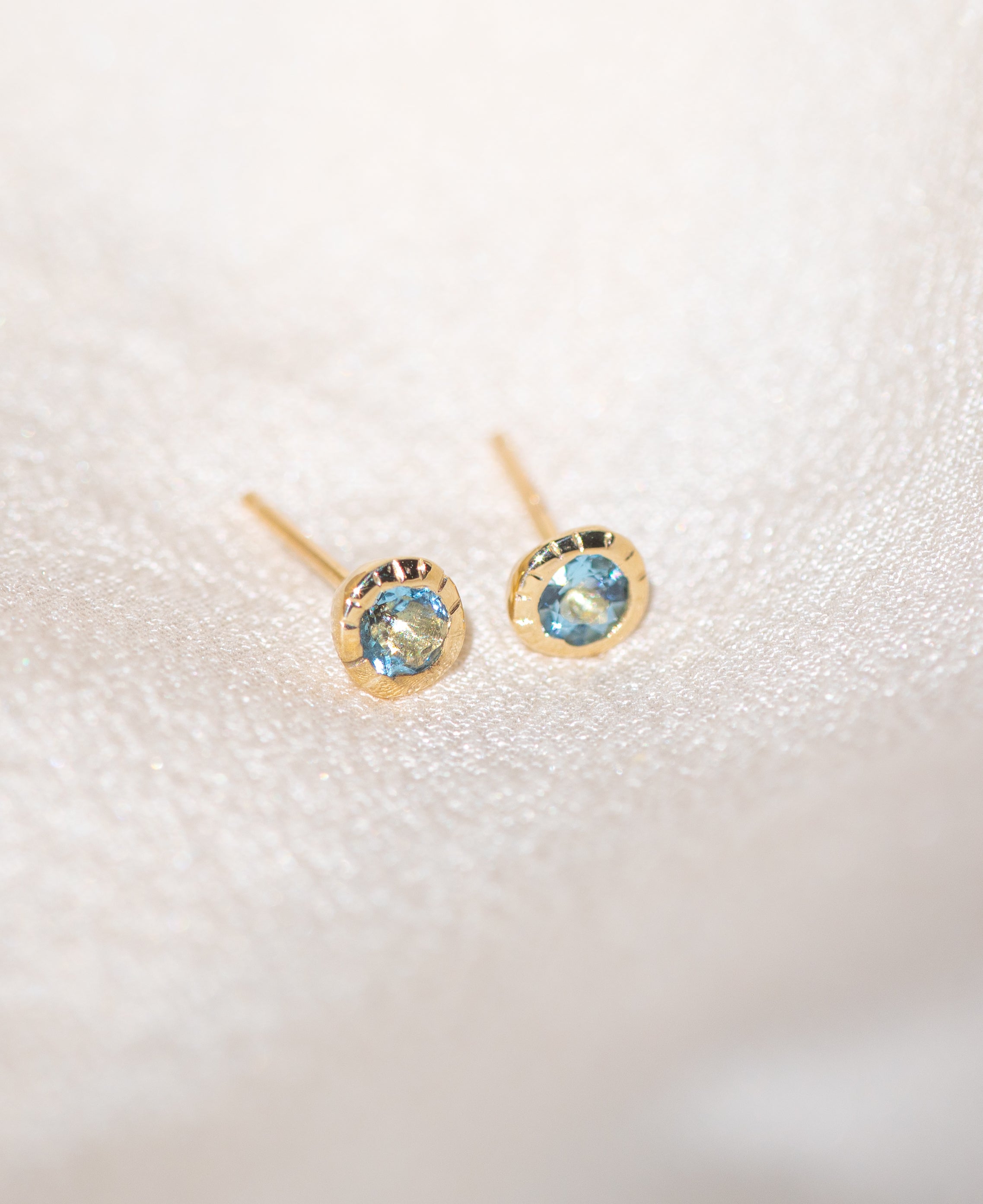 Pair of gold Heirloom Stud earrings with aquamarine stones