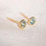 Pair of gold Heirloom Stud earrings with aquamarine stones