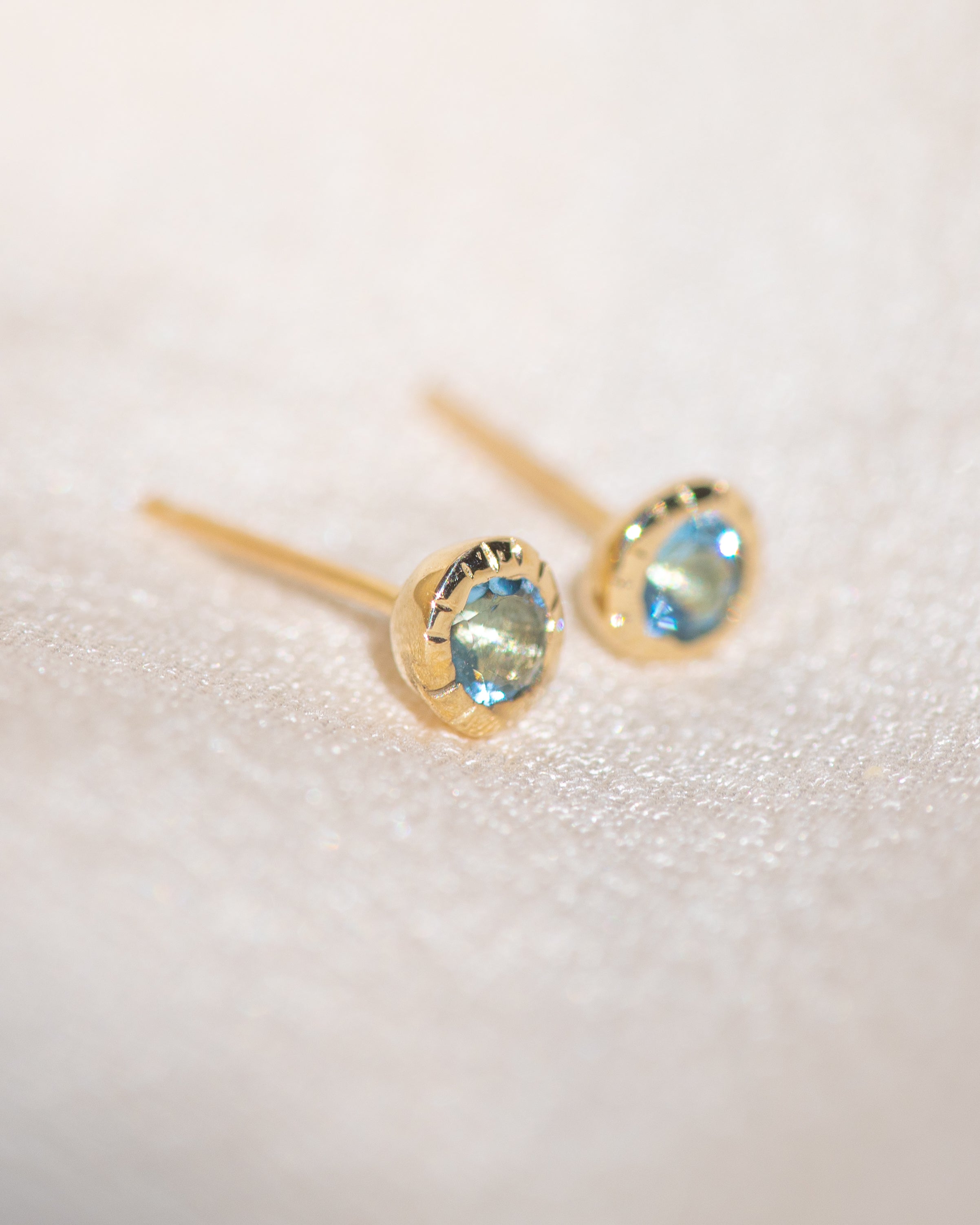 Pair of gold Heirloom Stud earrings with aquamarine stones