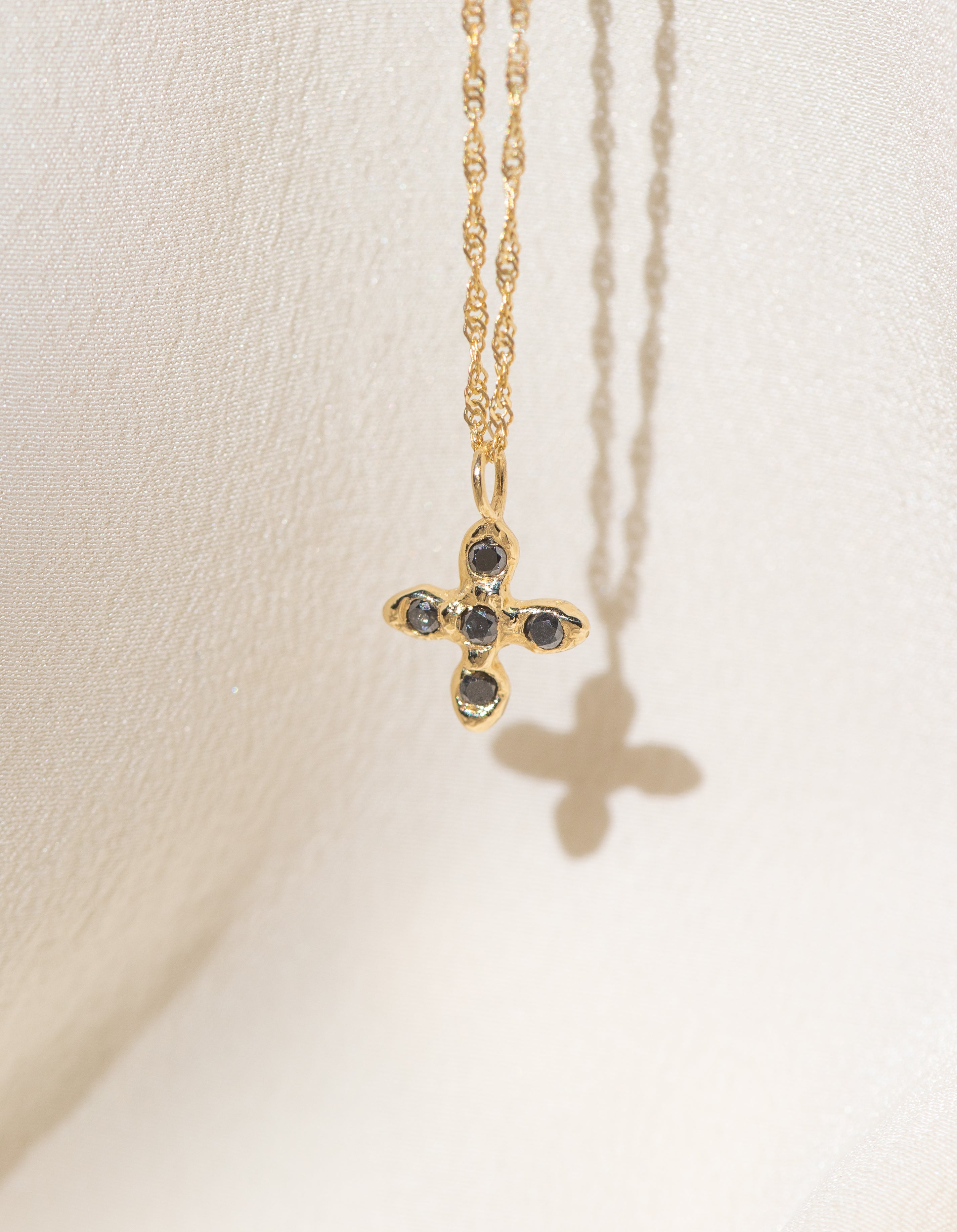 Gold Cross necklace with Black Diamond Stones