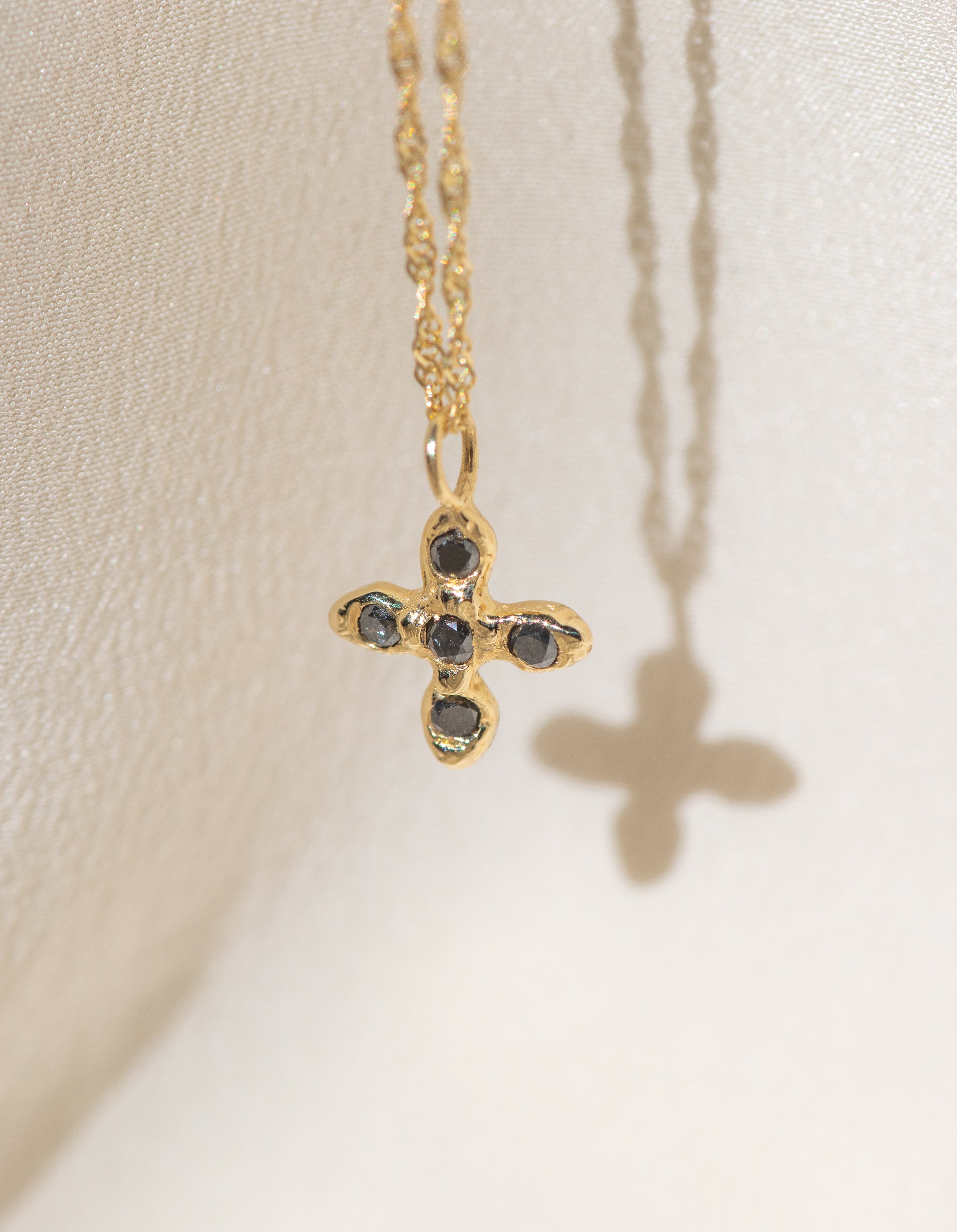 Gold Cross necklace with Black Diamond Stones