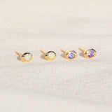 14kt Gold Studs featuring a 2mm Tanzanite and 2mm Opal